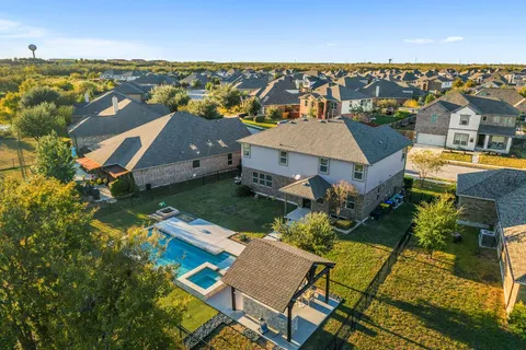 an aerial view of a house with a ocean view
