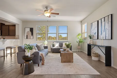 a living room with furniture fireplace and a flat screen tv