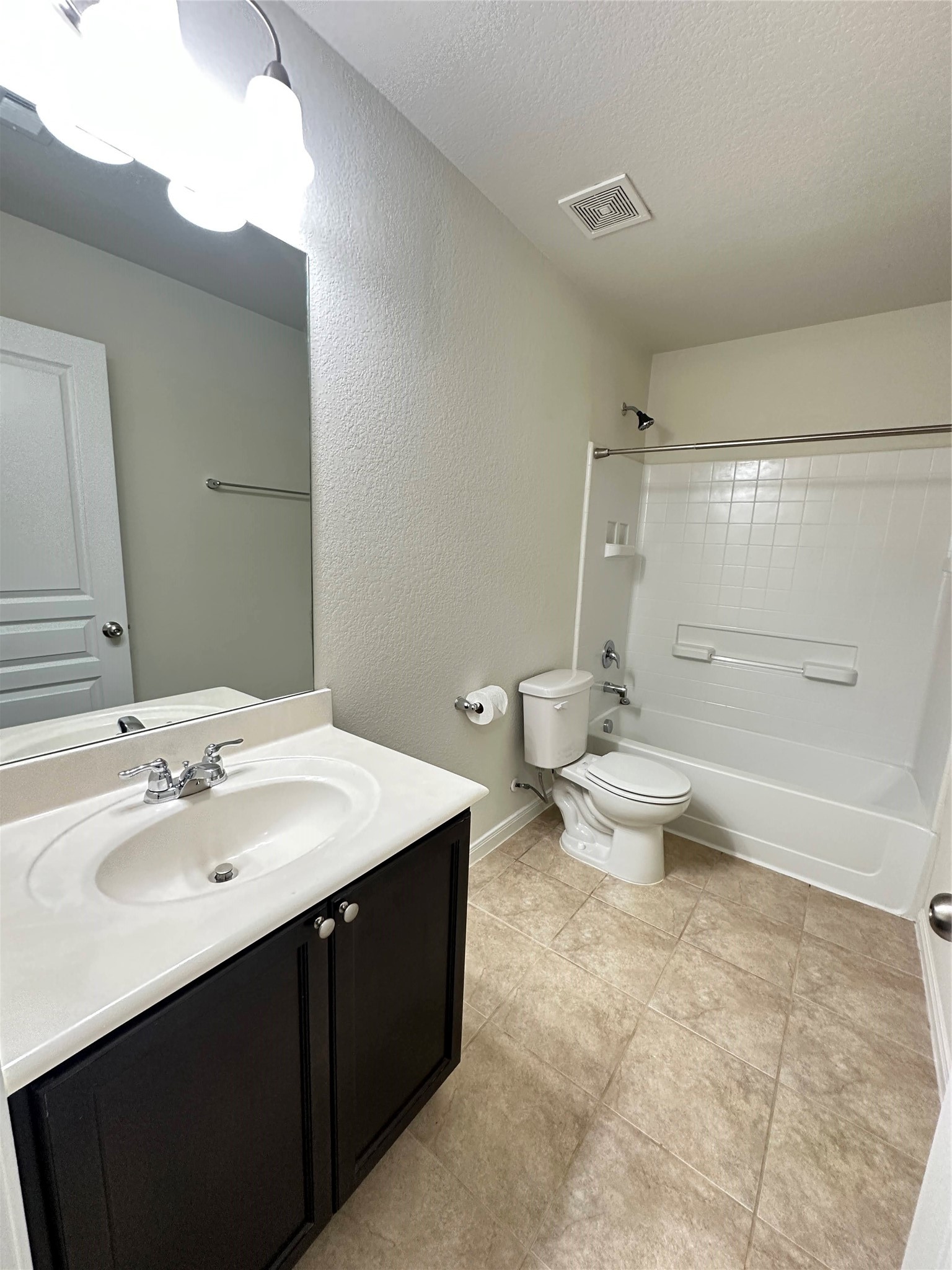 819 Messina Lane Rosenberg, TX 77469 - Photo 20 of 25 a spacious bathroom with a bathtub shower sink mirror and toilet