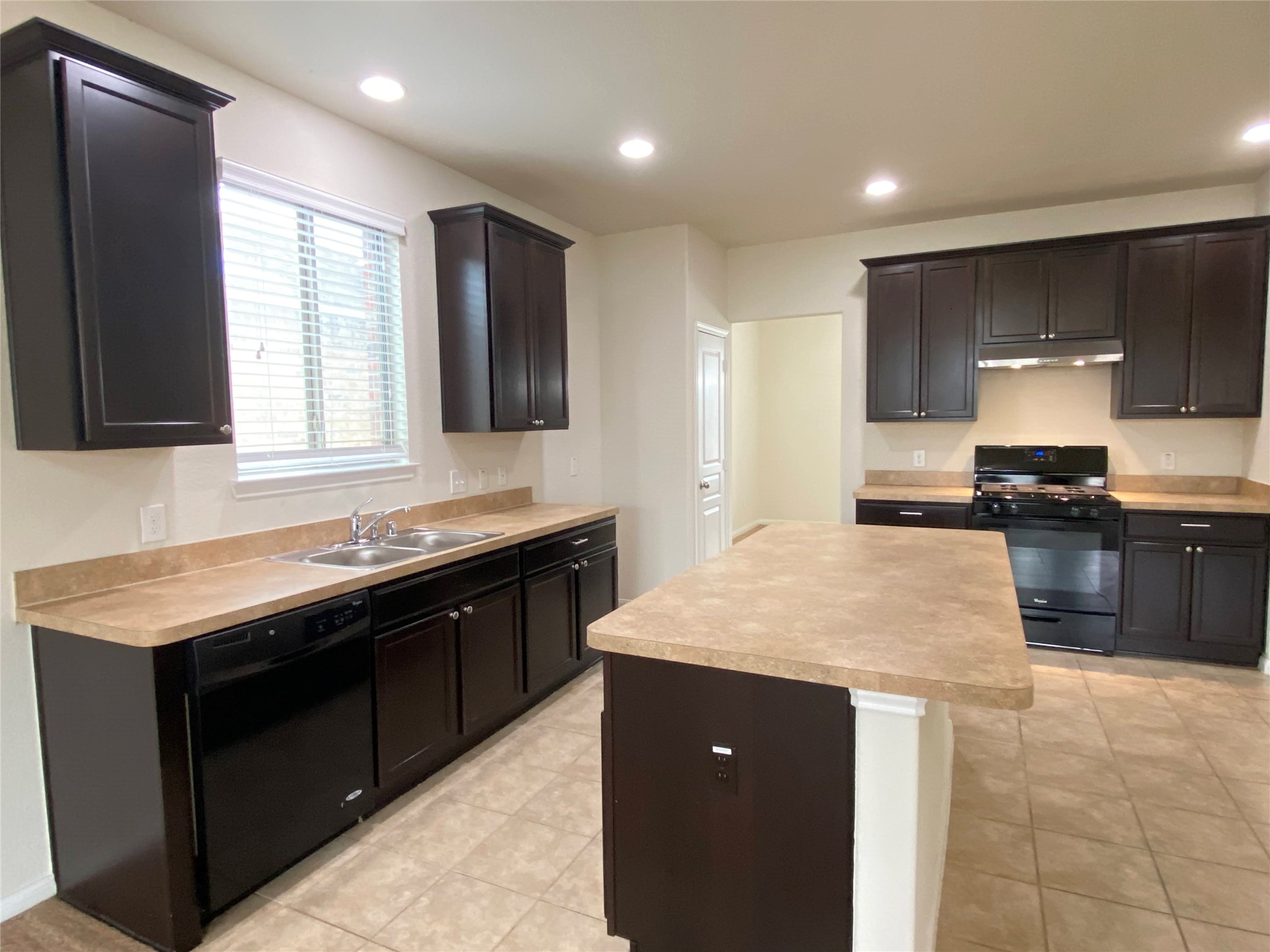 819 Messina Lane Rosenberg, TX 77469 - Photo 7 of 25 a large kitchen with stainless steel appliances granite countertop a sink stove and refrigerator