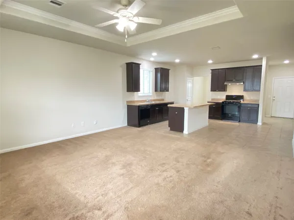 a view of a kitchen with a sink and a microwave
