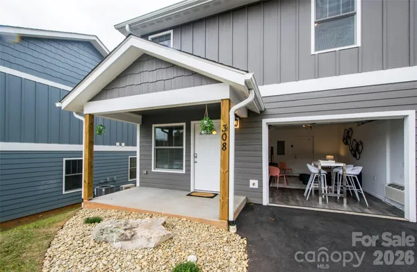 a view of a dinning table and chairs in patio of the house