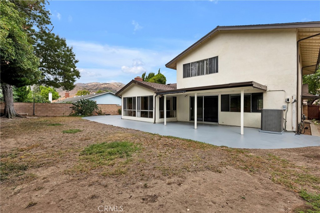 19034 Killoch Way Porter Ranch, CA 91326 - Photo 35 of 42 a front view of a house with a yard