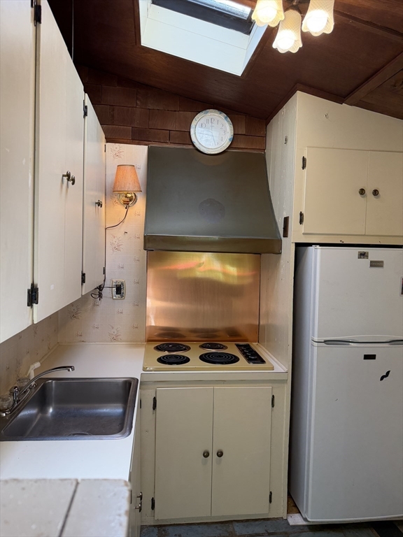 217-bb Tickle Road Westport, MA 02790 - Photo 17 of 24 a kitchen with a refrigerator and a stove
