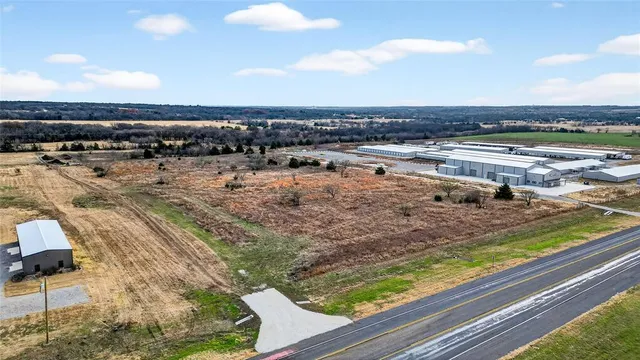 a view of a swimming pool and a yard