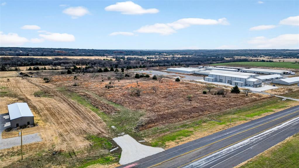 a view of a swimming pool and a yard
