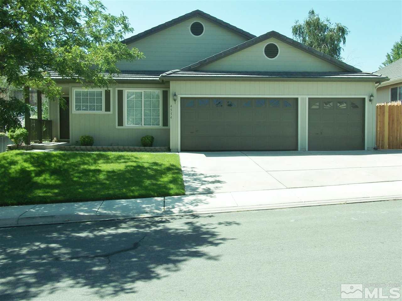 4554 Goodwin Road Sparks, NV 89436 - Photo 1 of 1 a front view of a house with garden
