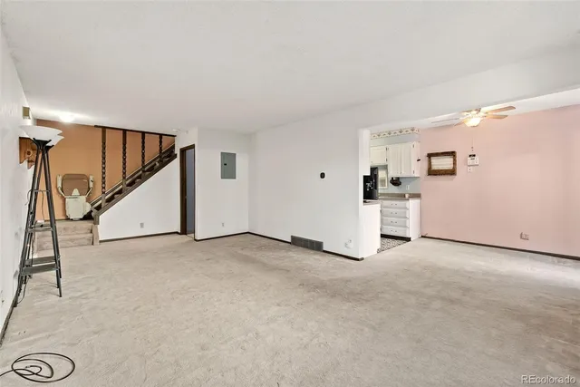 a view of an empty room with closet