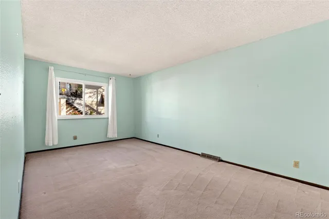 an empty room with window