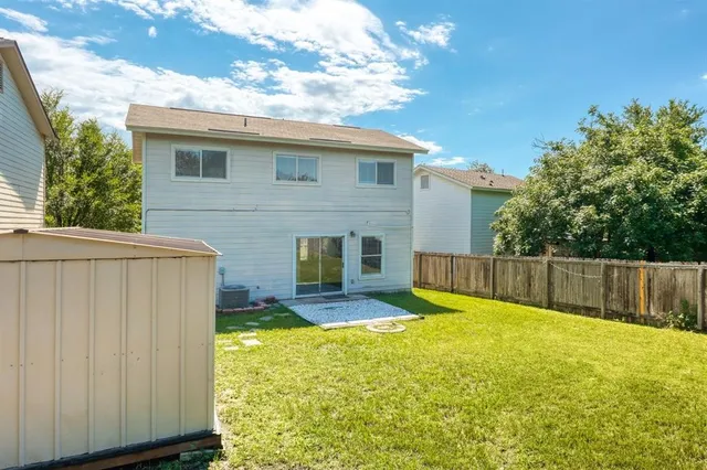 a view of a backyard with a small cabin