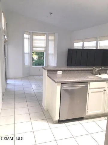 a kitchen with a cabinets and a stove top oven