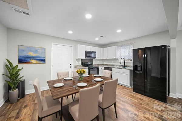 a kitchen with a table and chairs in it