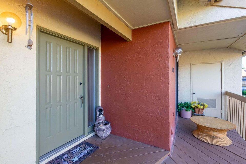 13045 Albright Court, Unit 12 Wellington, FL 33414 - Photo 2 of 11 a view of an entryway of the house