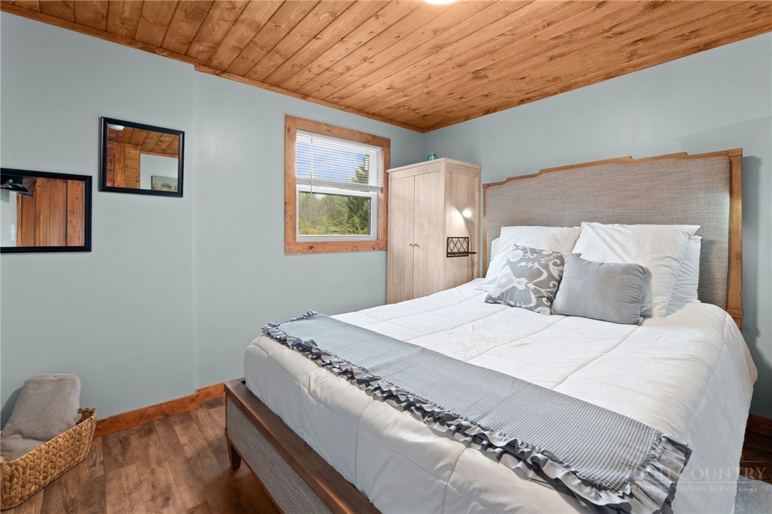 139 Golden Rod Loop Newland, NC 28657 - Photo 21 of 39 a bedroom with a bed and a window