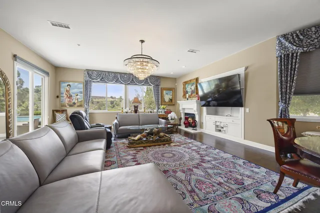 a kitchen with stainless steel appliances granite countertop a sink a stove and a microwave