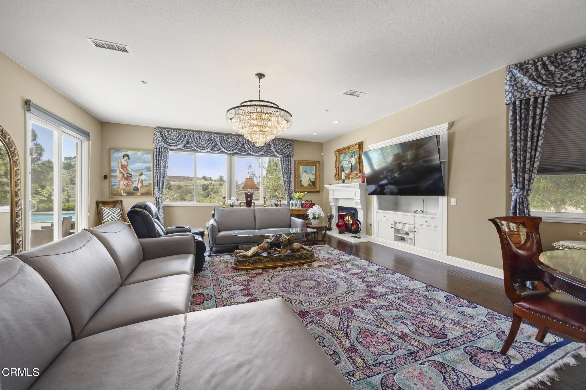 12390 Nelson Road Moorpark, CA 93021 - Photo 14 of 66 a living room with furniture a flat screen tv and a window