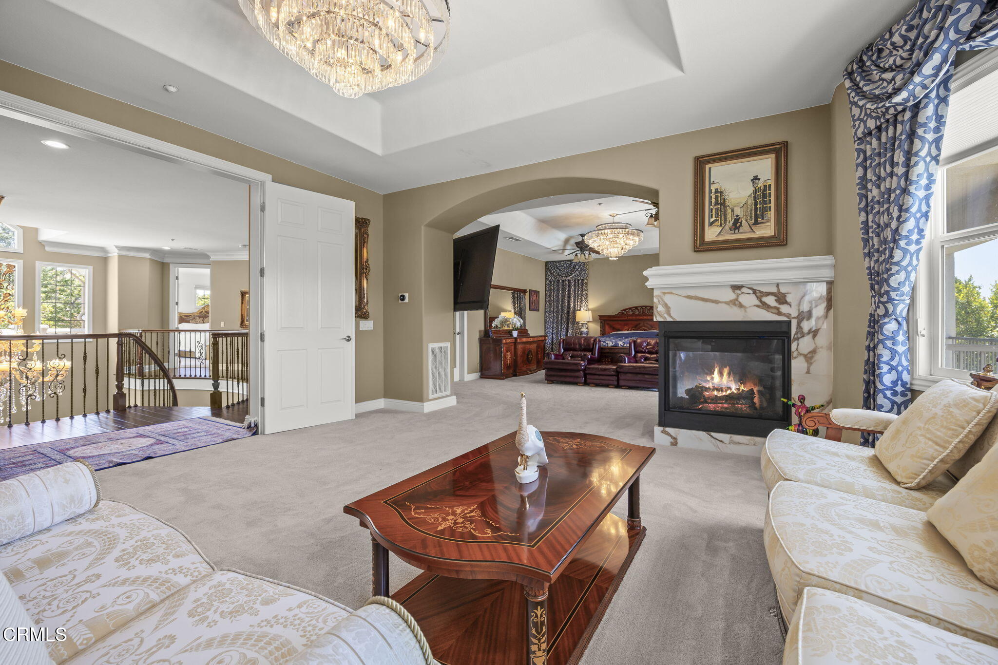 12390 Nelson Road Moorpark, CA 93021 - Photo 21 of 66 a living room with furniture a large window and a fireplace