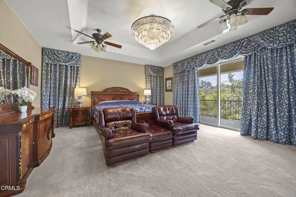 a bed room with a bed and a television