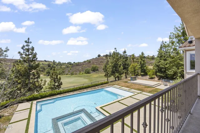 a spacious bathroom with a granite countertop sink a mirror and a