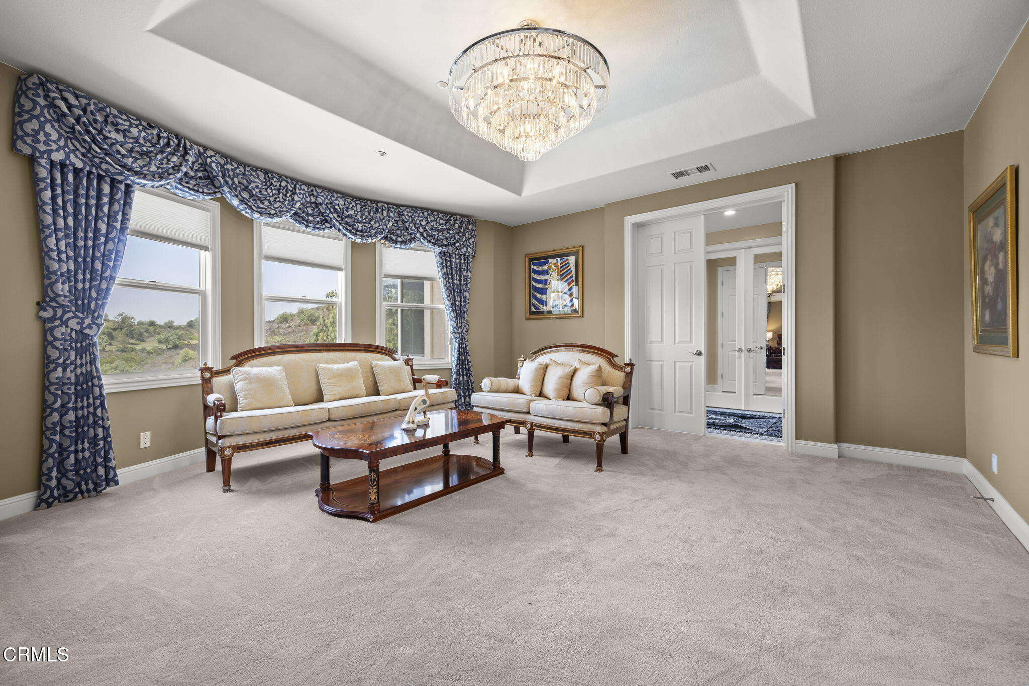12390 Nelson Road Moorpark, CA 93021 - Photo 28 of 66 a living room with furniture and a chandelier