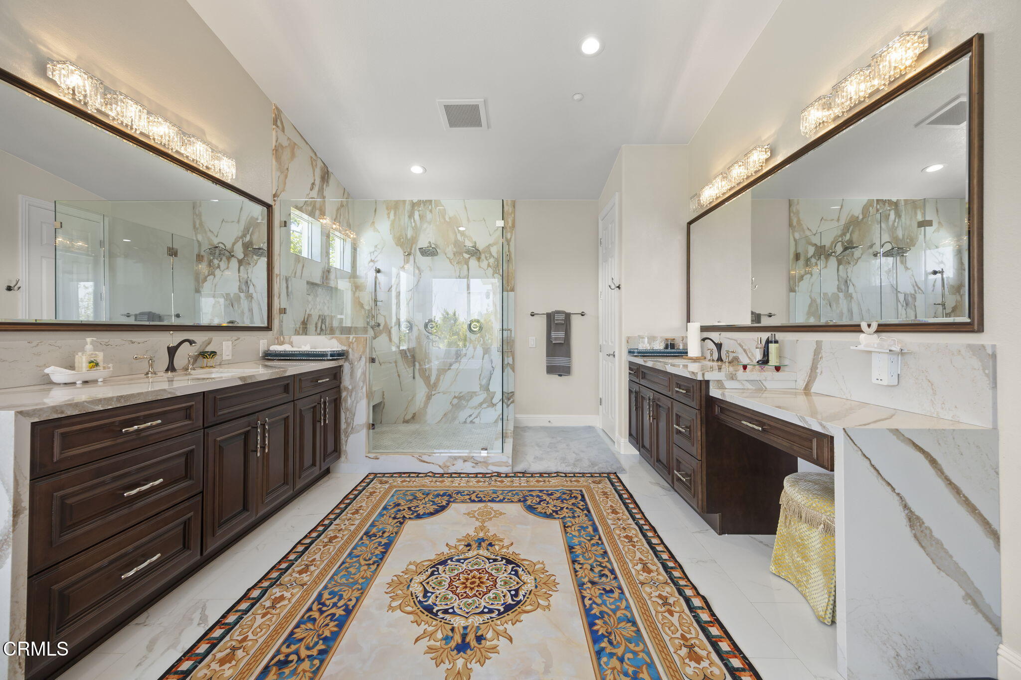 12390 Nelson Road Moorpark, CA 93021 - Photo 30 of 66 a large bathroom with a double vanity sink a large mirror and a bathtub