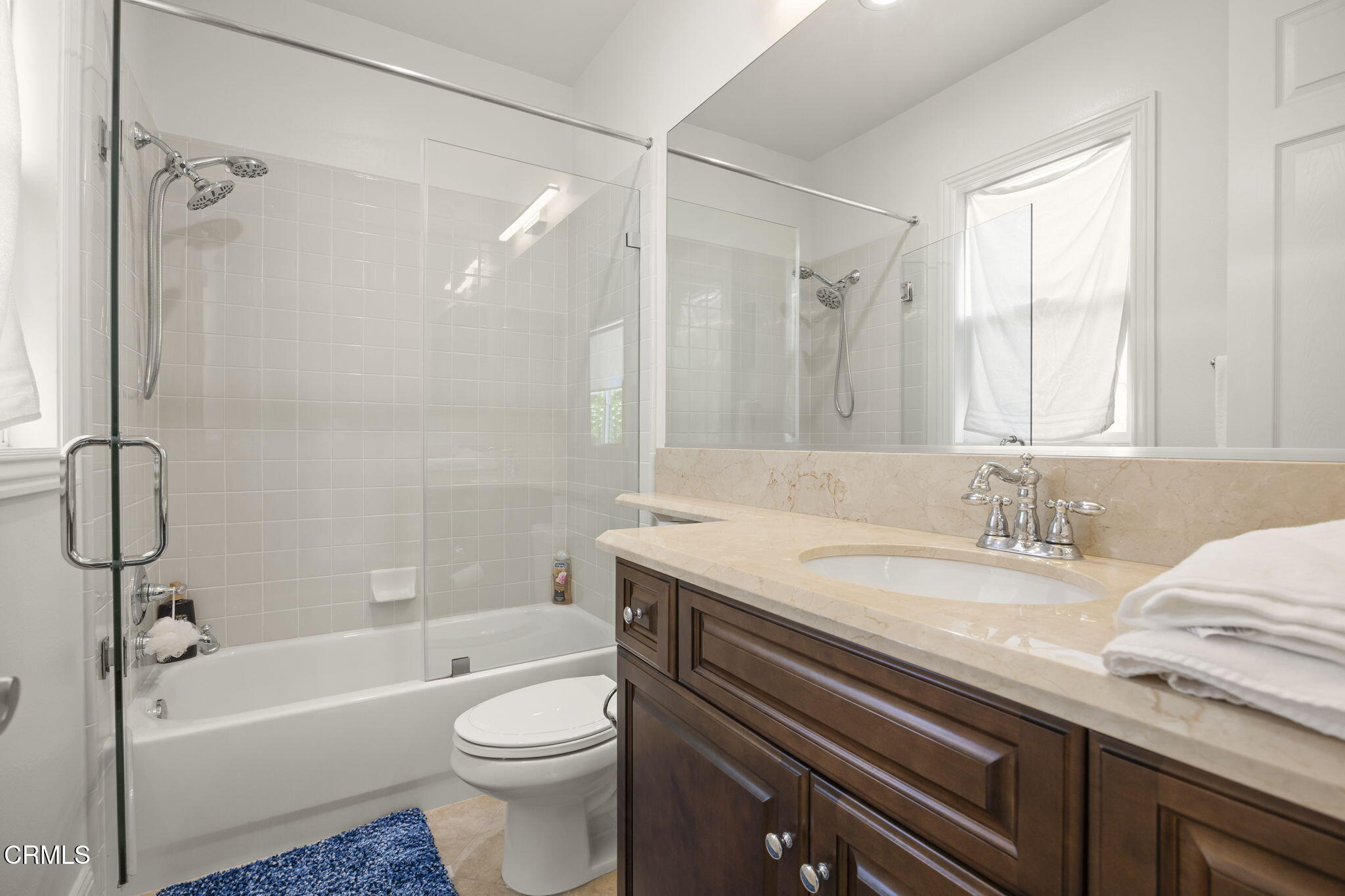 12390 Nelson Road Moorpark, CA 93021 - Photo 39 of 66 a bathroom with a granite countertop sink toilet and shower