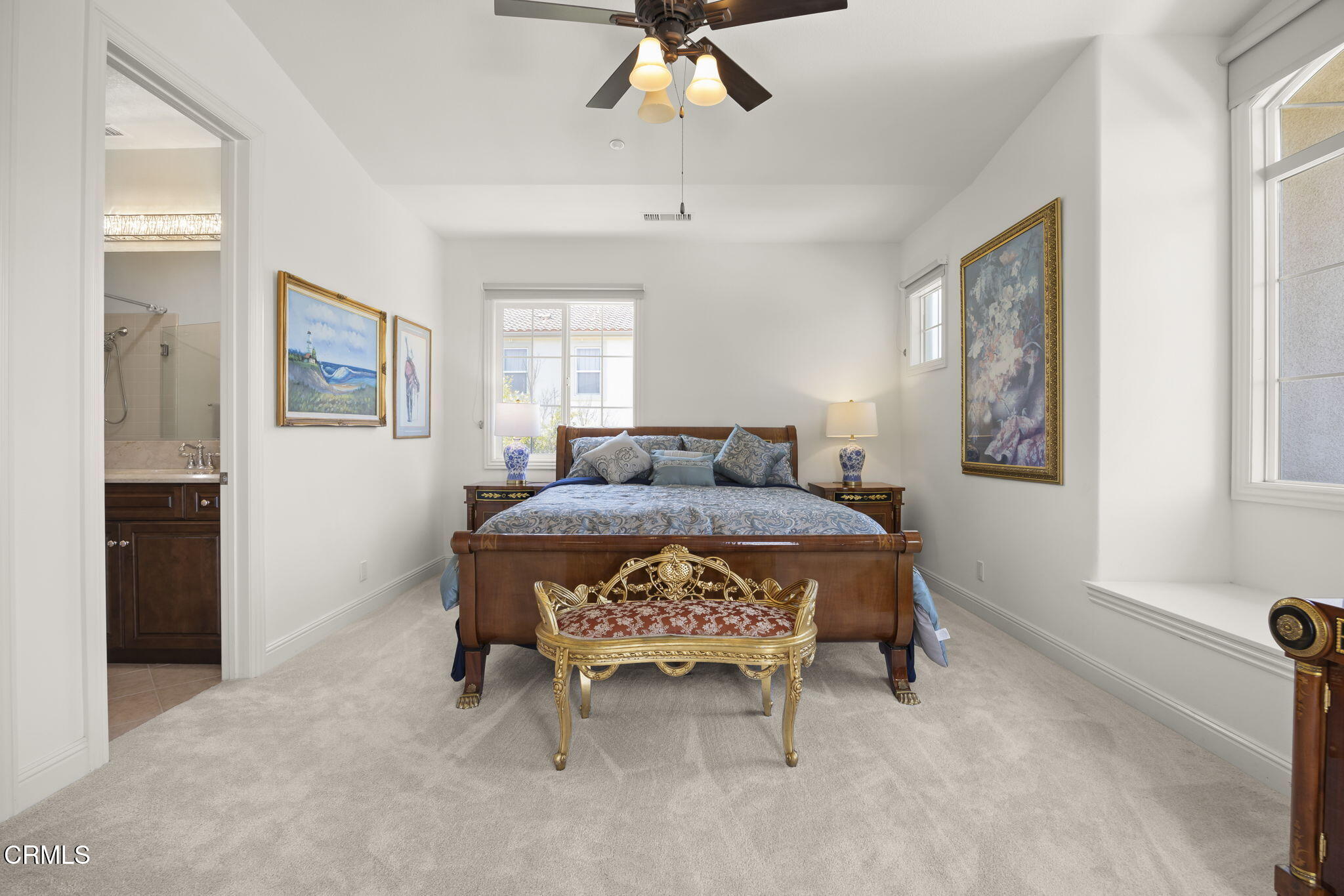 12390 Nelson Road Moorpark, CA 93021 - Photo 40 of 66 a spacious bedroom with a bed and a window