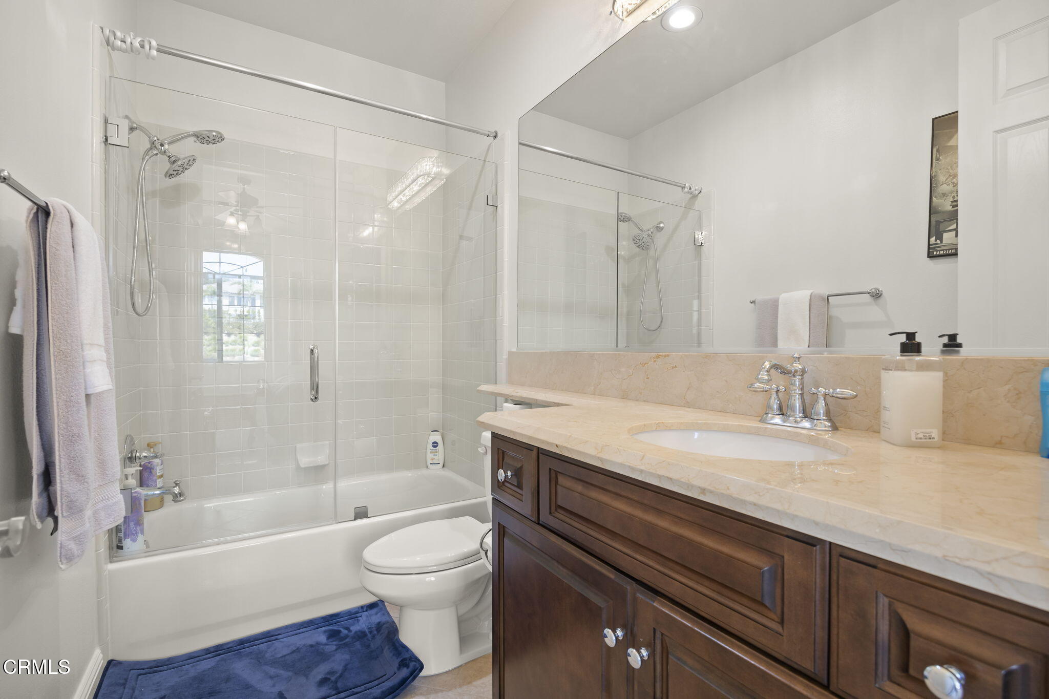 12390 Nelson Road Moorpark, CA 93021 - Photo 41 of 66 a bathroom with a granite countertop bathtub shower sink vanity and toilet