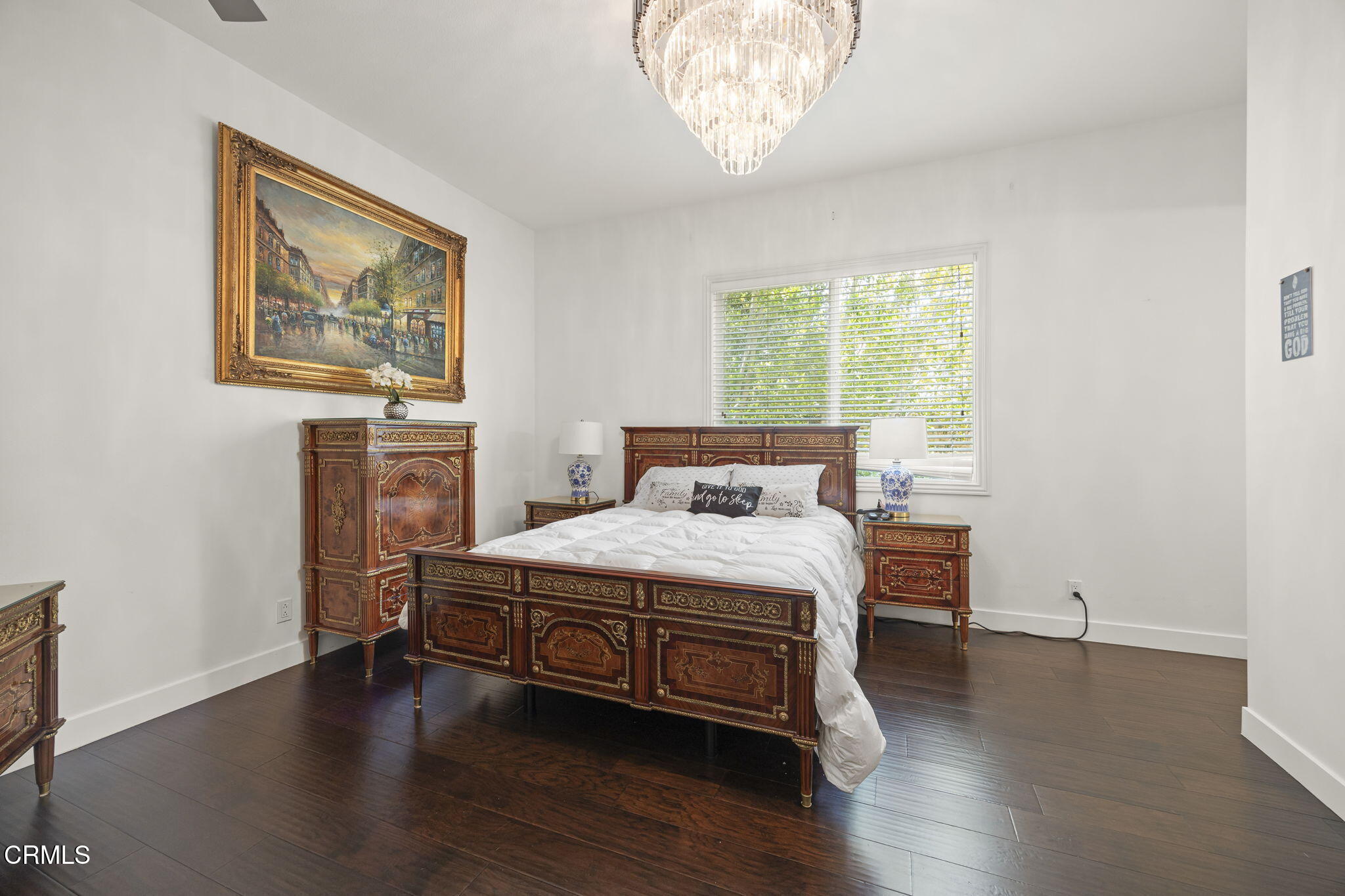 12390 Nelson Road Moorpark, CA 93021 - Photo 47 of 66 a bedroom with a bed and a chandelier