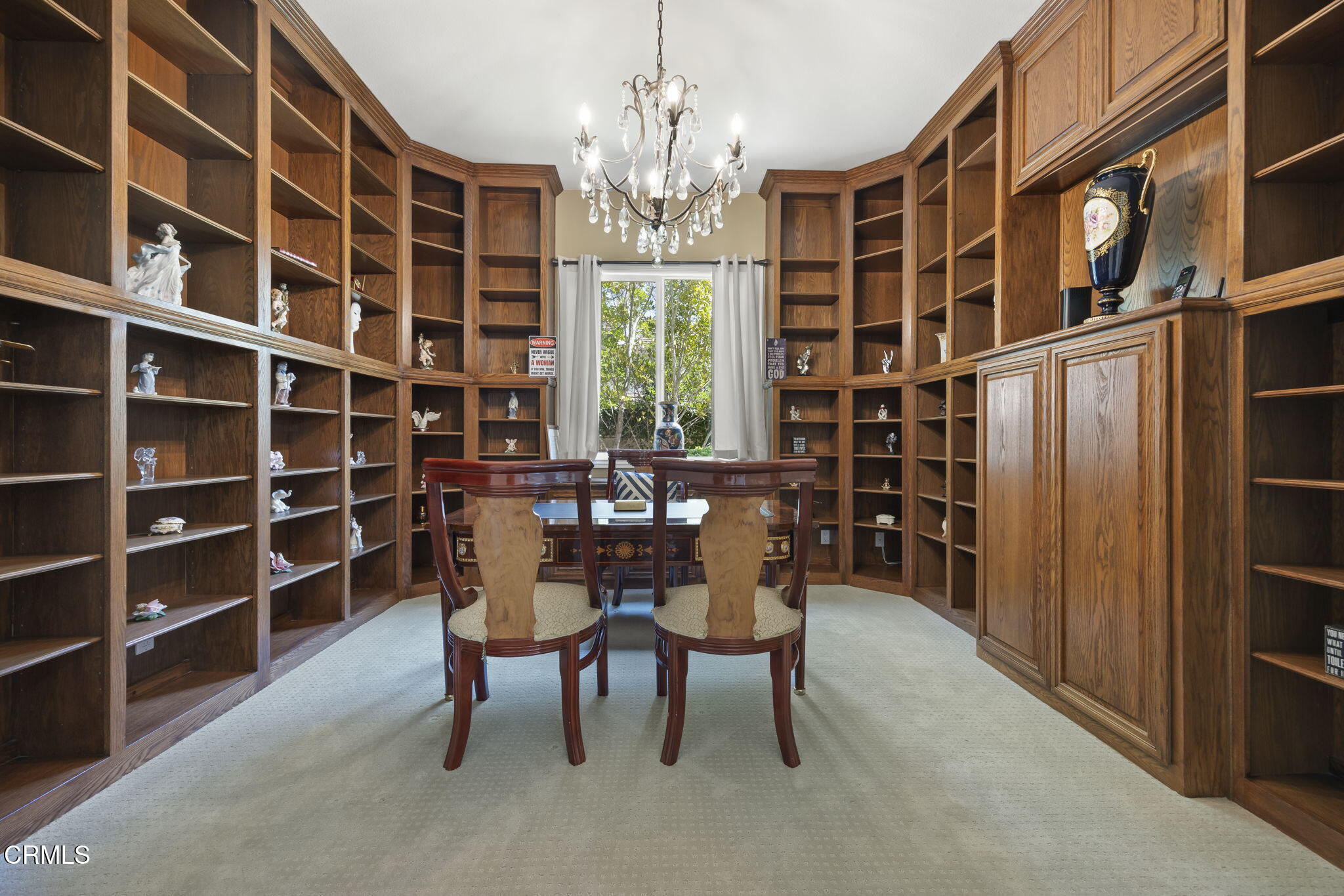 12390 Nelson Road Moorpark, CA 93021 - Photo 49 of 66 a view of a dining room with furniture and a chandelier
