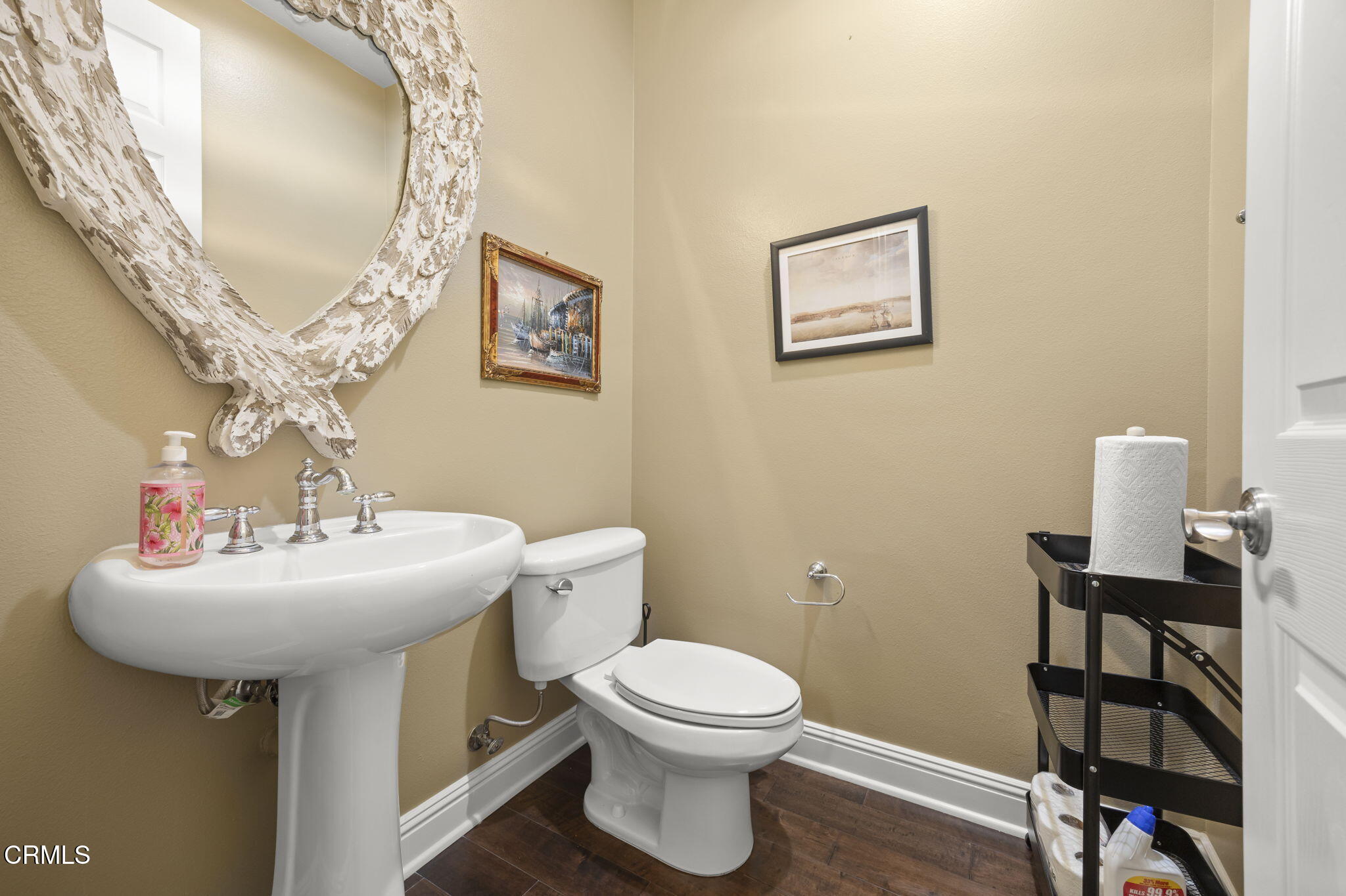 12390 Nelson Road Moorpark, CA 93021 - Photo 50 of 66 a bathroom with a toilet sink and mirror
