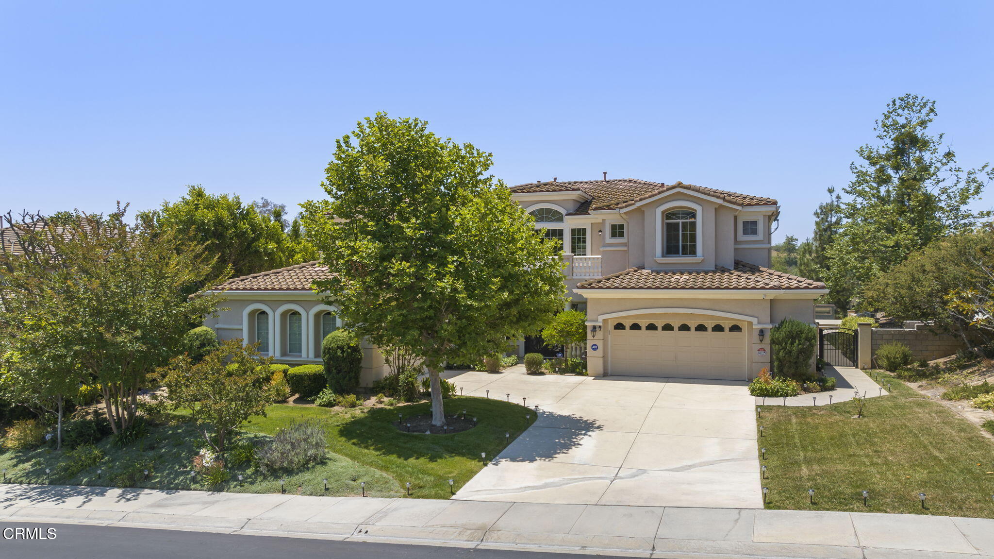 12390 Nelson Road Moorpark, CA 93021 - Photo 62 of 66 a front view of a house with a garden
