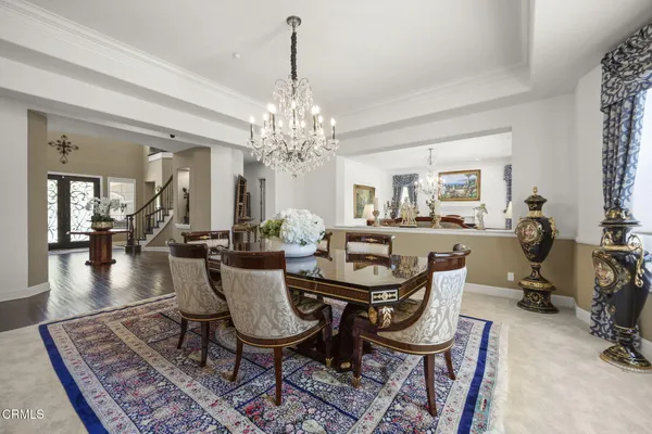 a living room with furniture chandelier and a chandelier