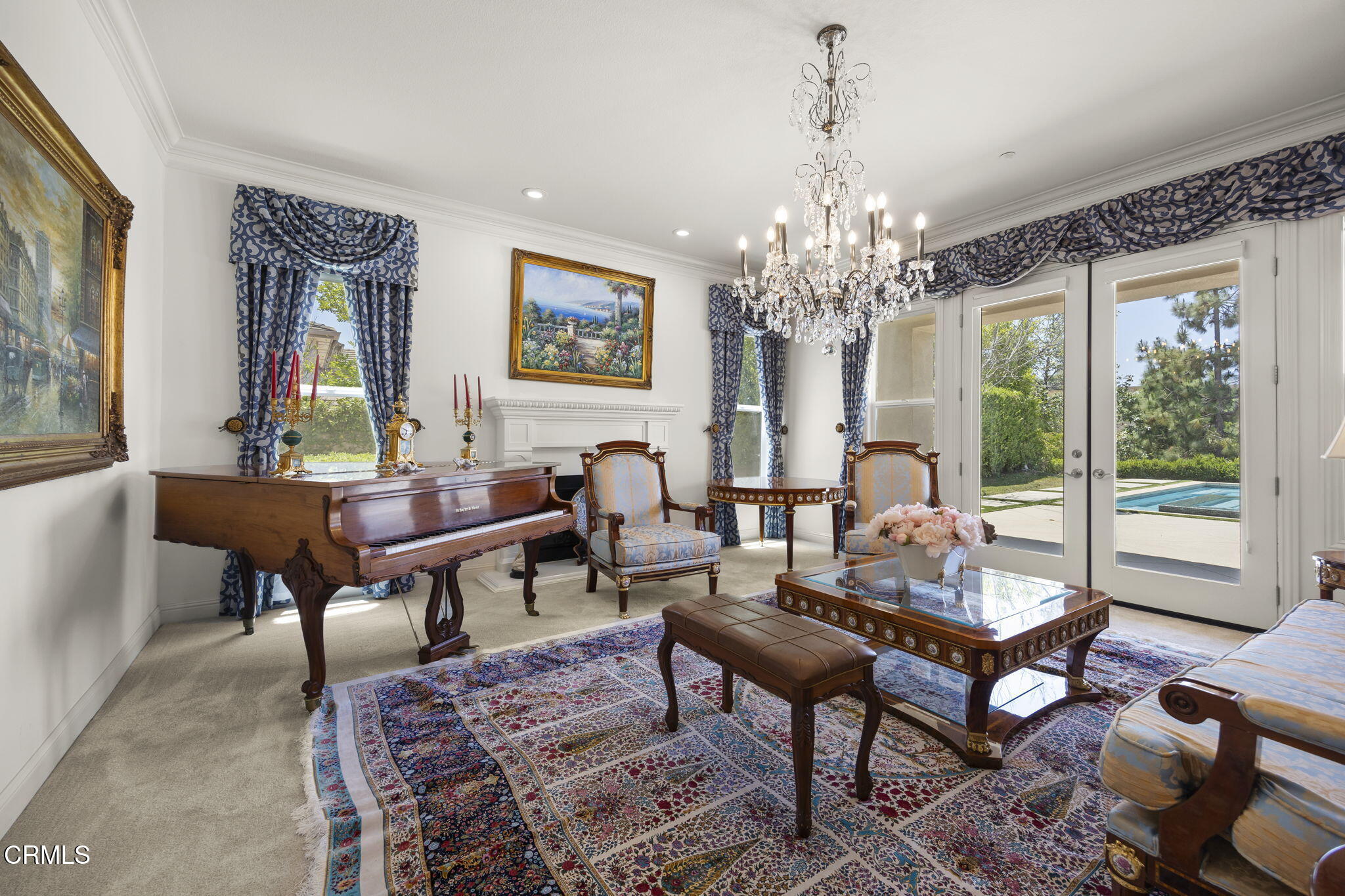 12390 Nelson Road Moorpark, CA 93021 - Photo 10 of 66 a living room with furniture and a chandelier