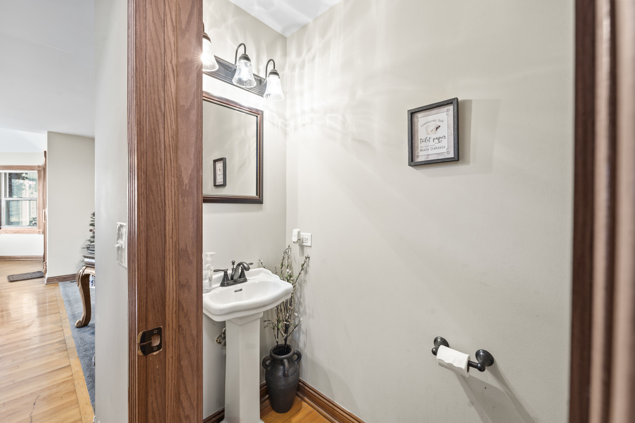 1502 Eagle Ridge Drive Antioch, IL 60002 - Photo 2 of 2 a bathroom with a sink mirror and toilet