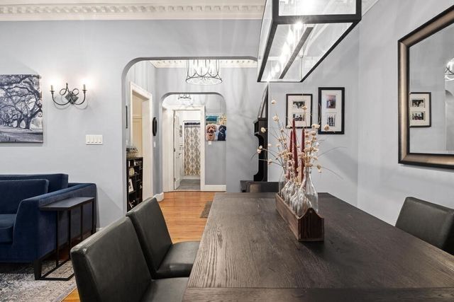 a living room with furniture a rug and a window