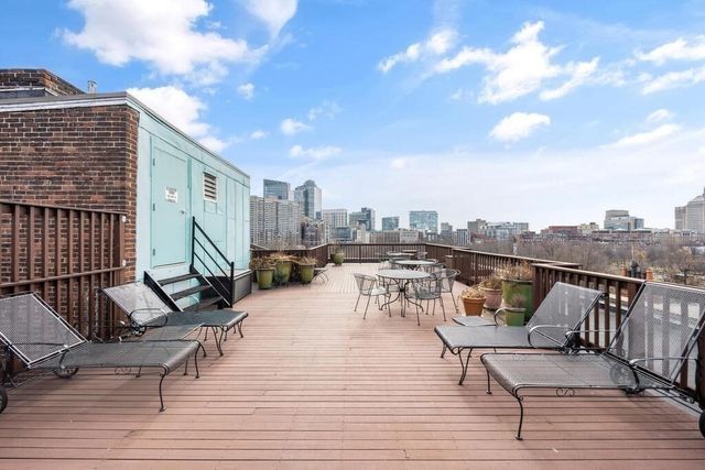 a view of a swimming pool with an outdoor seating