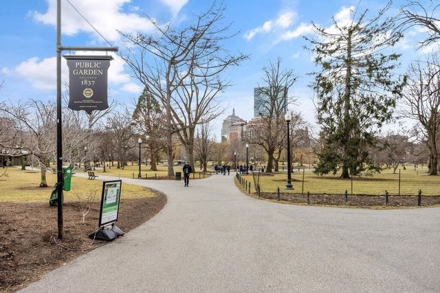 a city street lined with buildings and cars
