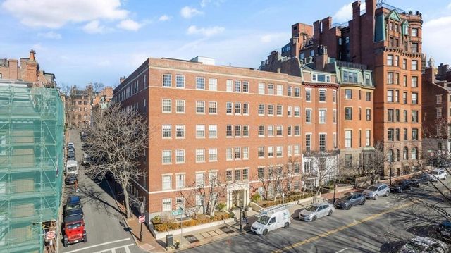 a view of balcony with wooden floor and seating space