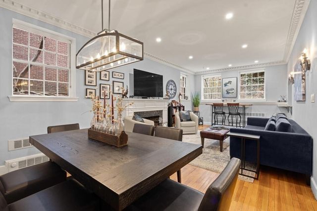 a living room with fireplace furniture and a flat screen tv