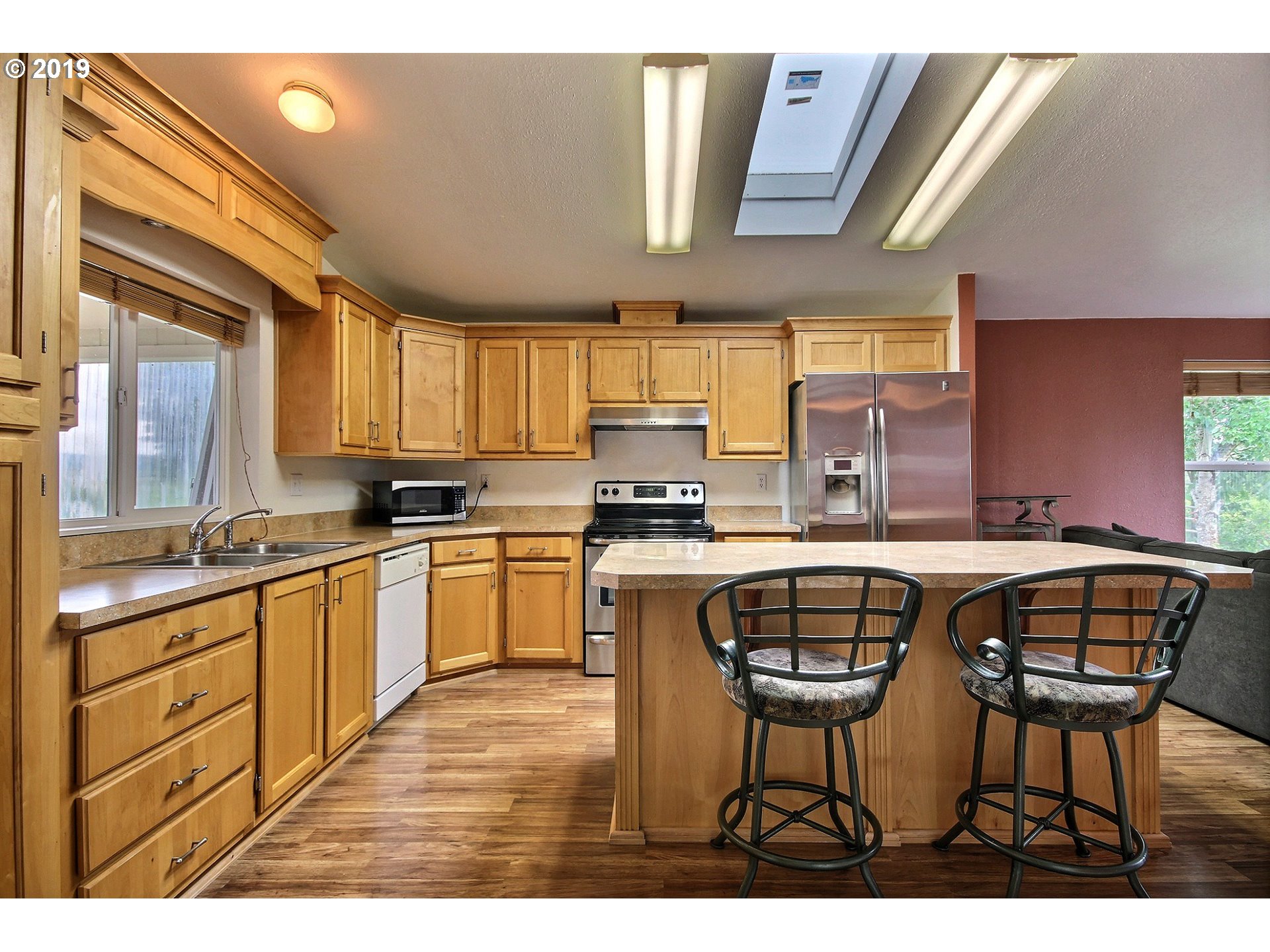 11275 Southwest Spring Hill Road Gaston, OR 97119 - Photo 4 of 17 a kitchen with stainless steel appliances granite countertop a stove a sink and a granite counter tops