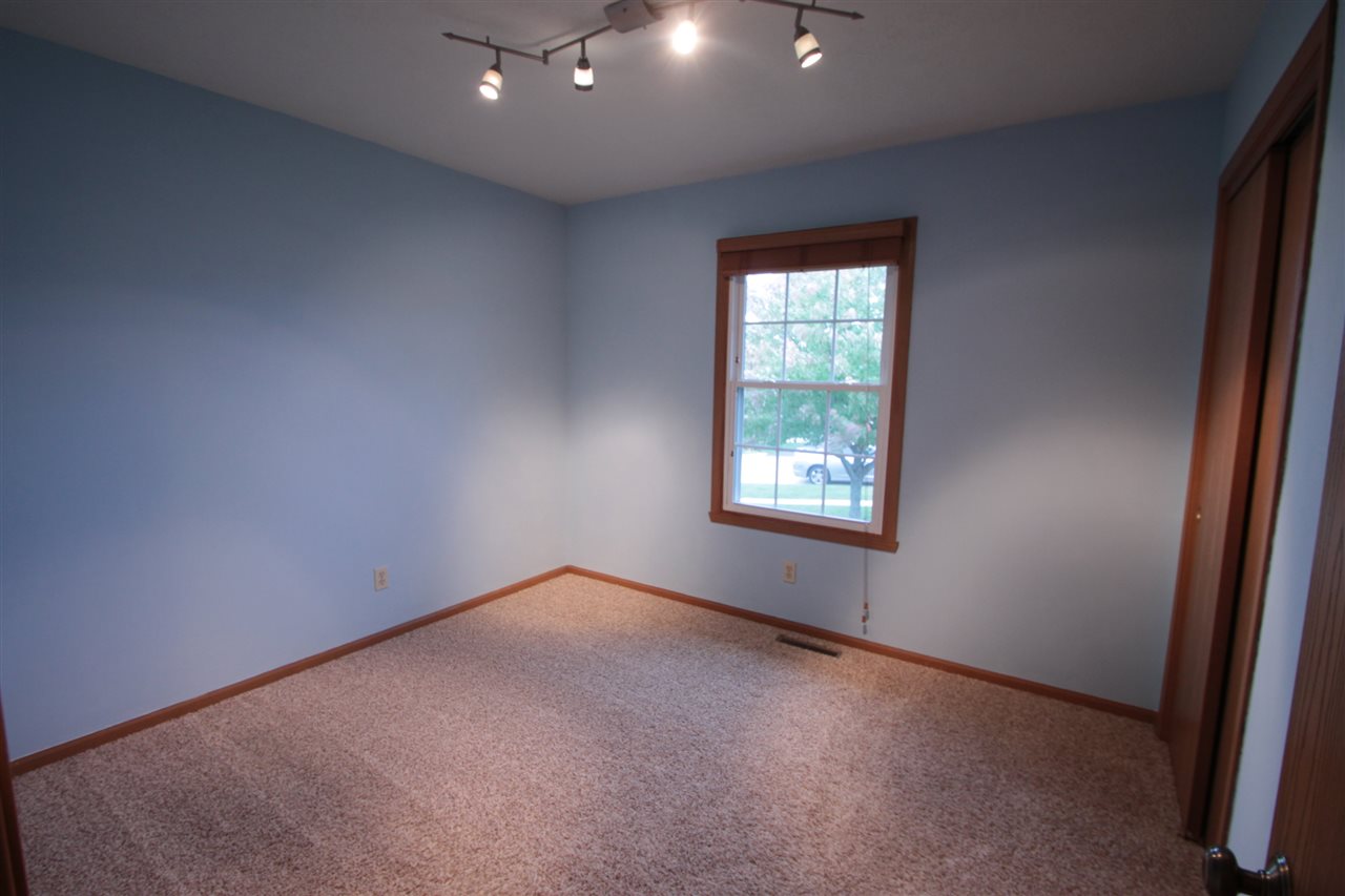 5467 Torque Road Loves Park, IL 61111 - Photo 11 of 21 an empty room with windows