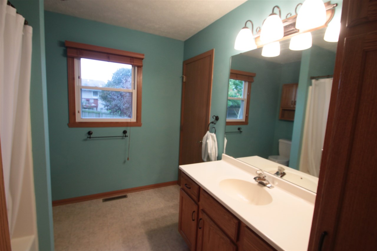 5467 Torque Road Loves Park, IL 61111 - Photo 13 of 21 a bathroom with a sink and a mirror