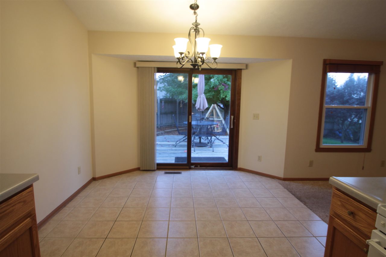 5467 Torque Road Loves Park, IL 61111 - Photo 8 of 21 a view of an empty room with window and chandelier