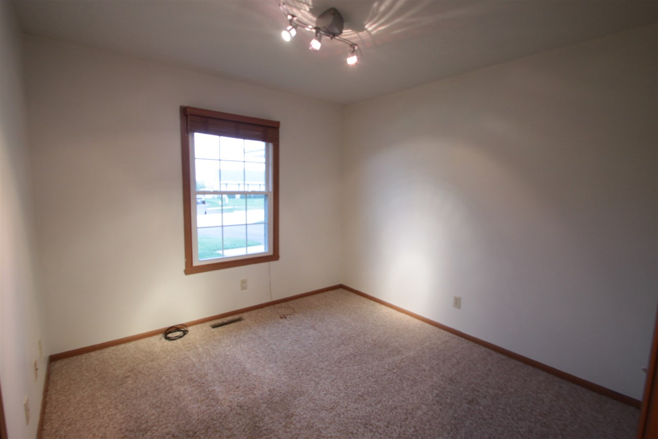 5467 Torque Road Loves Park, IL 61111 - Photo 10 of 21 an empty room with a window