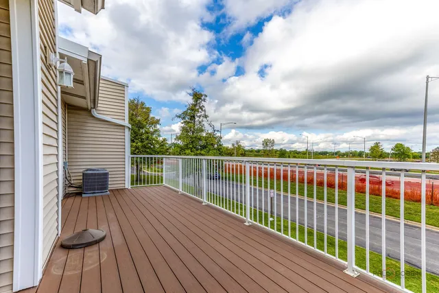 a view of balcony with wooden floor
