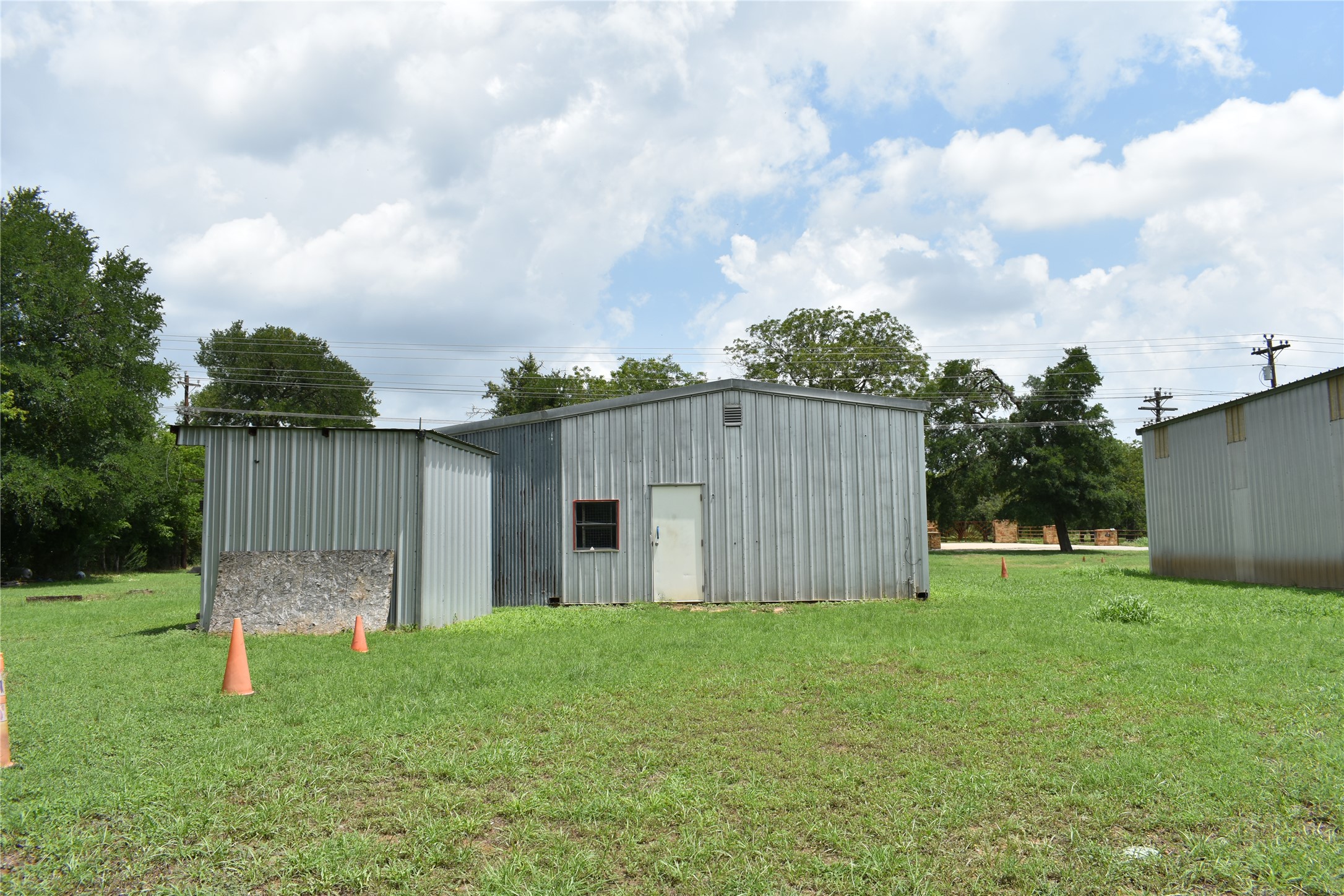 291 Reids Bend Bastrop, TX 78602 - Photo 12 of 39 a view of a backyard with a garden and wooden fence