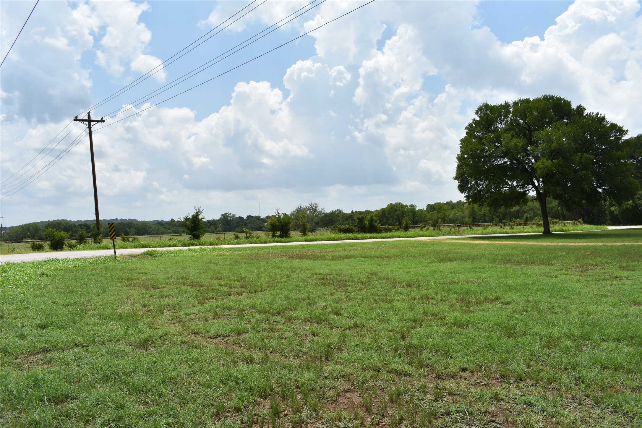 291 Reids Bend Bastrop, TX 78602 - Photo 23 of 39 a view of a golf course with a lake
