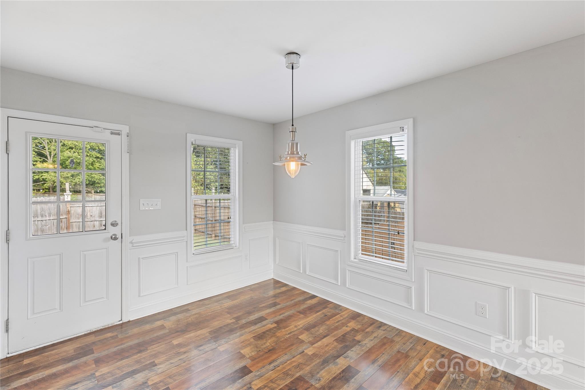 758 Main Street Southwest Concord, NC 28027 - Photo 11 of 25 a view of empty room with wooden floor and fan
