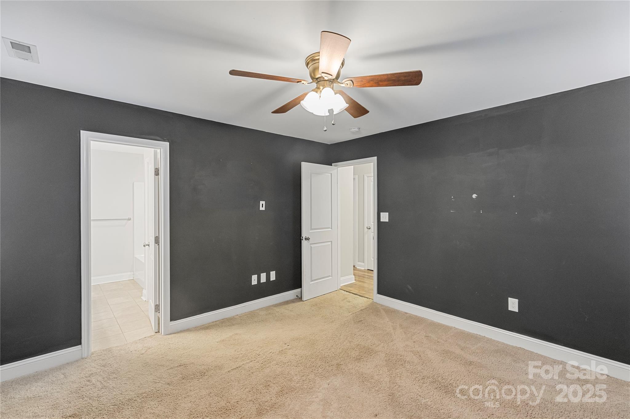 758 Main Street Southwest Concord, NC 28027 - Photo 14 of 25 a view of a livingroom with a ceiling fan and window